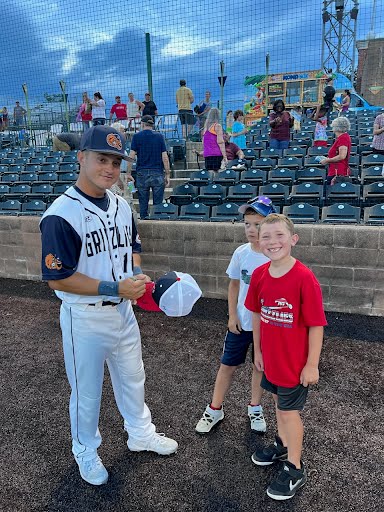 Wargo signs autographs after the Grizzle's game on Faith and Famy Night